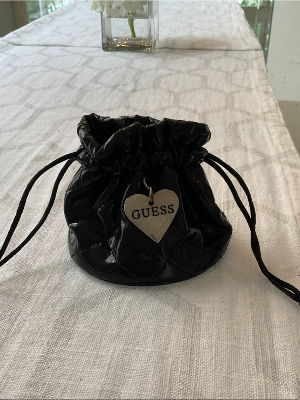 Guess Black Quilted Patent Drawstring Pouch with Heart Charm